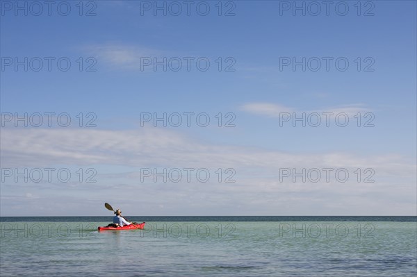 Man Kayaking on Ocean, Florida Keys, USA