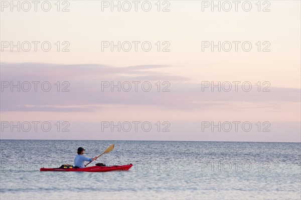 Man Kayaking on Ocean, Florida Keys, USA