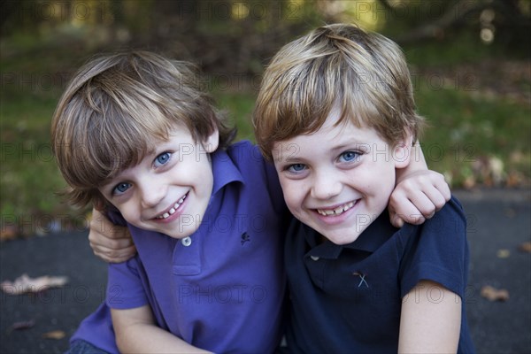 Two Young Boys Hugging Each Other