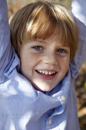 Smiling Boy With Arms Up, Close-Up