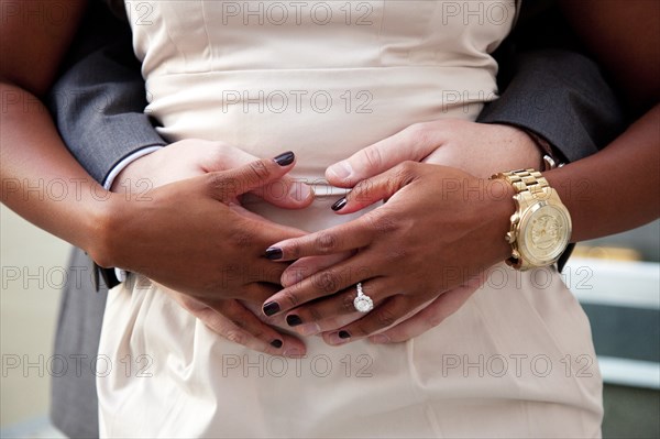 Couple's Hands Touching at Waist