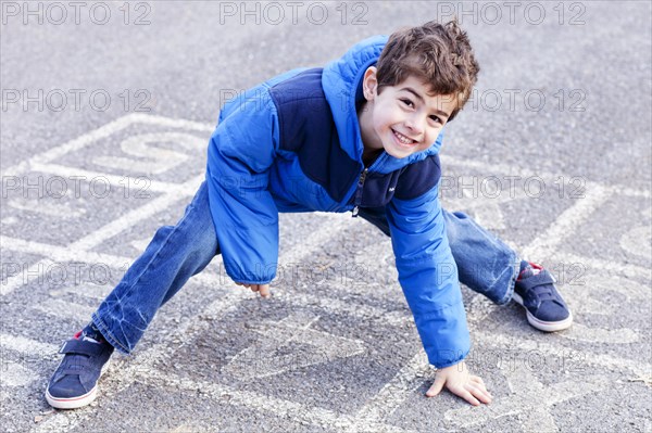 Smiling Boy on Hopscotch Court