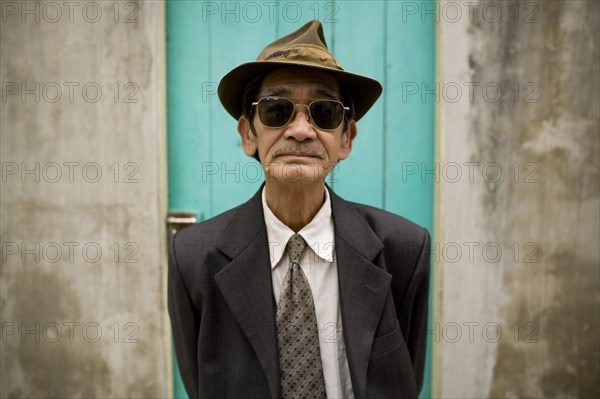Vietnamese Man in Suit, Hat and Sunglasses