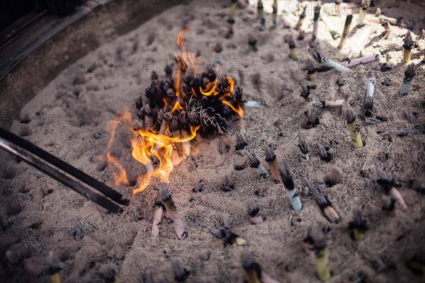 Burning Scrolls and Incense at Temple, Tokyo, Japan