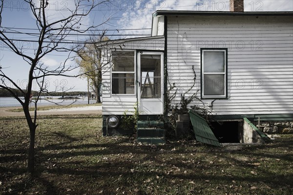 Side of House With Bare Tree in Yard, Grafton, Illinois, USA