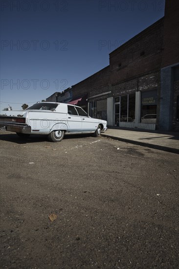 Classic Car Parked in Front of Rundown Stores on Main Street, Leland, Mississippi, USA