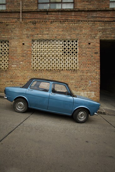 Small Blue Car Parked on Steep Road, San Gil, Colombia