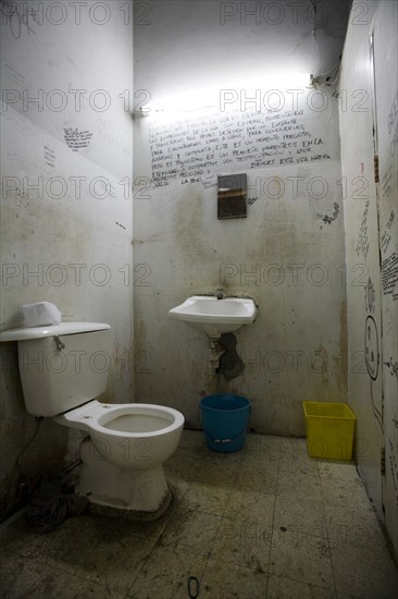 Dirty Bathroom With Writing on Walls