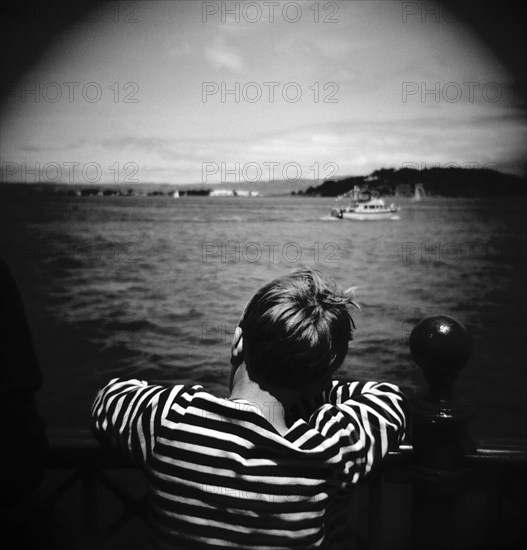 Boy Looking Out Over the Water