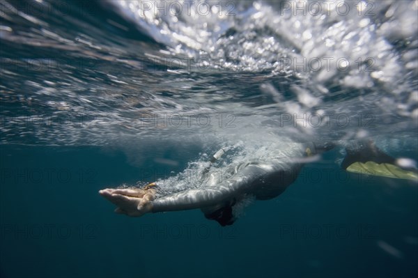 Free Diver Entering Water