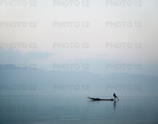 Man Leg Rowing on Lake Inle in Burma