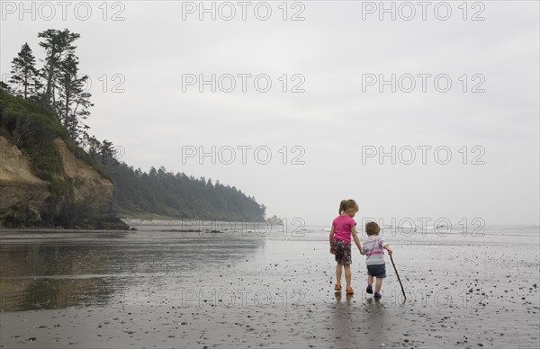 Two Little Girls Walking on Beach