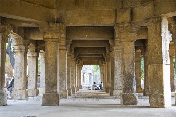 Two People Sitting in Ancient Ruins, New Delhi, India