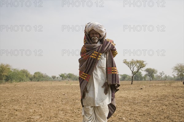 Older Indian Man in Field