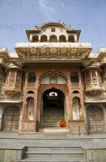 Woman Sitting on Steps of Old Building in Pushkar, India