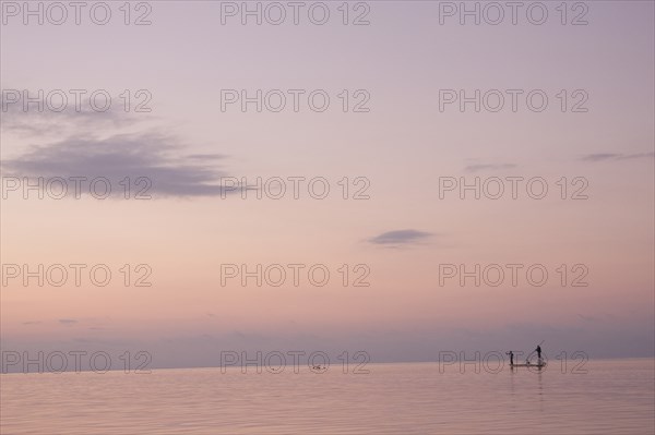 Two Men Fishing in Boat on Calm Water, Florida Keys, USA