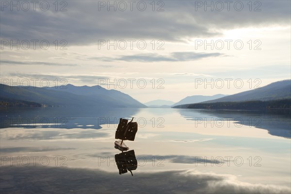 Crude Toy Boat in Calm Lake, Glacier National Park, Montana, USA