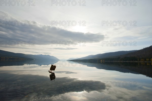 Crude Toy Boat in Calm Lake, Glacier National Park, Montana, USA