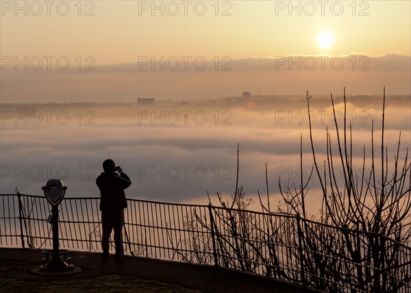 Person Photographing Fog Over River