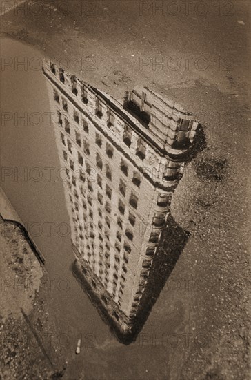 Flatiron Building Reflection in Puddle, New York City, USA