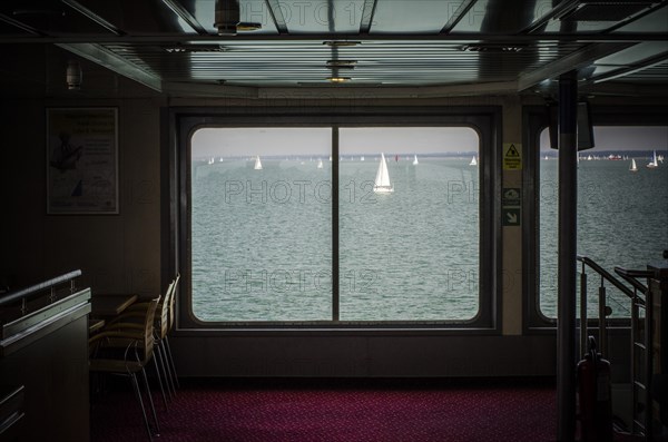 View of Sailboats in Bay from Ferry Interior