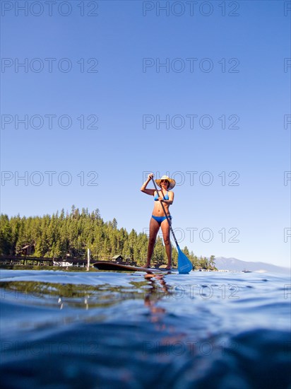 Woman on Paddleboard on Lake, Low Angle View