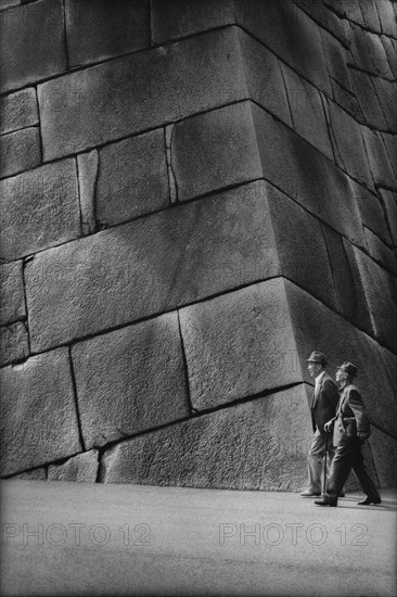 Two Men Walking by Imperial Palace Stone Wall, Tokyo, Japan