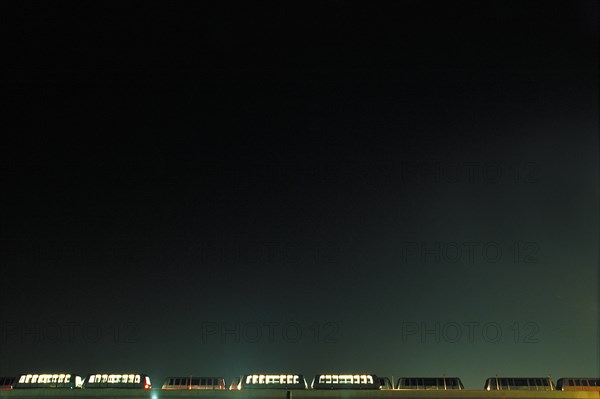 Airport Shuttle Trains at Night