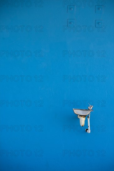 Water Fountain Against Blue Wall