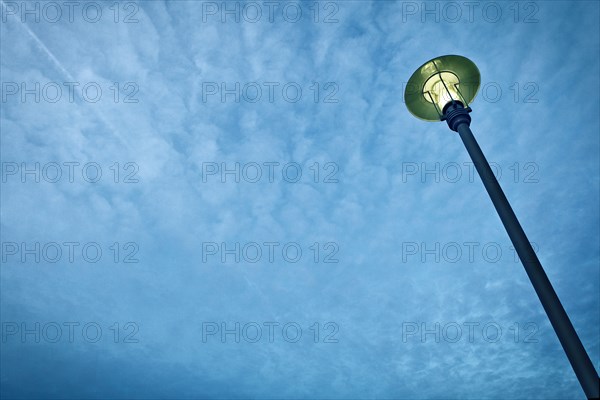 Street Light Against Blue Sky With Clouds