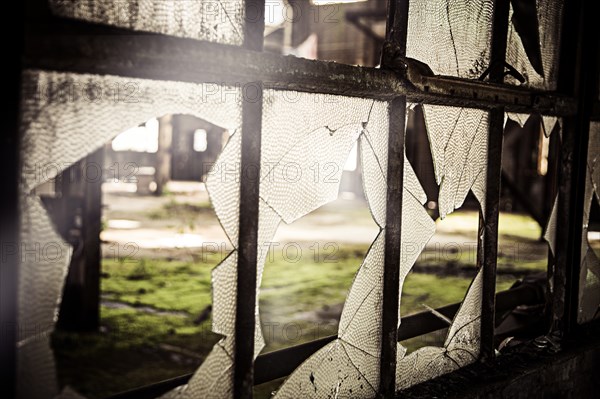 Broken Window in Abandoned Warehouse