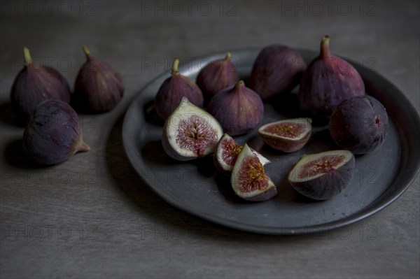 Sliced and Whole Figs on Plate