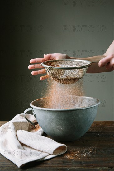 Flour and Cake Mix Being Sifted into Bowl