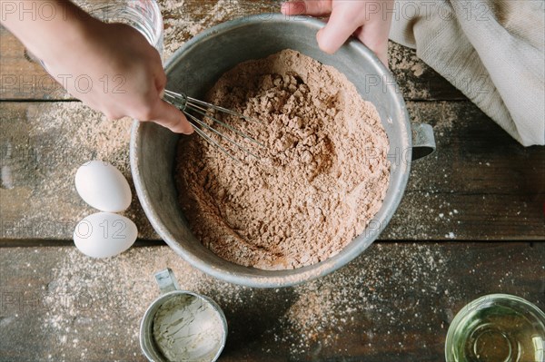 Ingredients Being Whisked in with Cake Mix, High Angle View