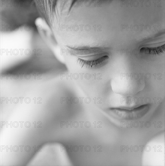 Young Boy Looking Down, Close-Up