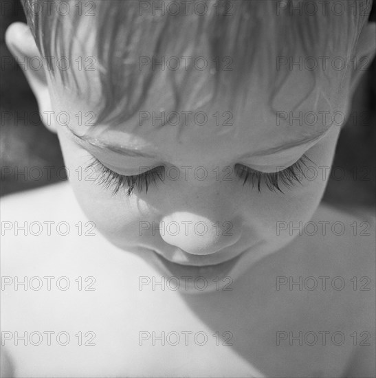Young Boy Looking Down, High Angle View