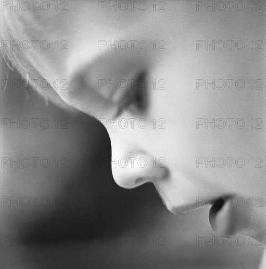 Young Boy Looking Down, Close-Up Profile