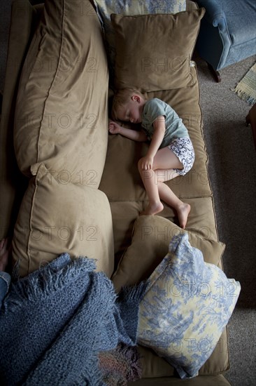 Young Boy Sleeping on Couch, High Angle View