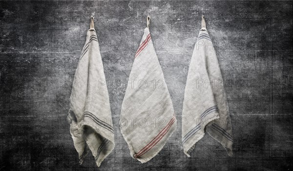 3 Linen Towels Hanging on Slate Gray Stone Wall