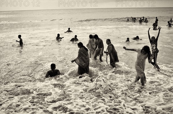 Group of People Playing in Ocean, India