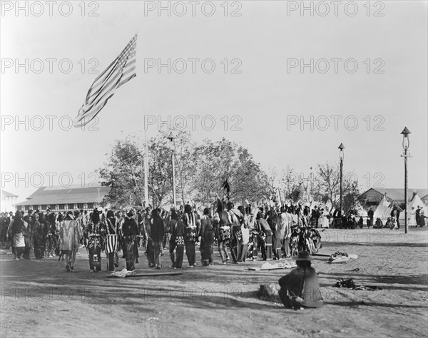 Ghost Dance, Cheyennes & Arapahoes in Circle around Flagpole, Indian Congress of the Trans-Mississippi and International Exposition, by Adolph F. Muir, F.A. Rinehart, 1898