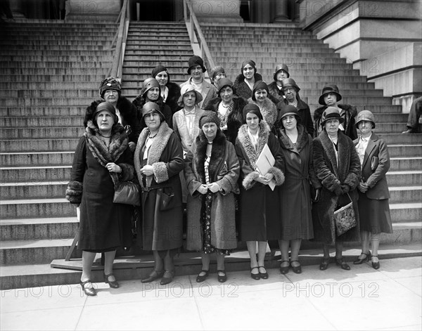 National Association Women Lawyers to see President Hoover through four representatives, asking for United States Plenipotentiaries to the Hague to vote for a World Code of equality between men and women, L-R front row: Mrs. Olive Stott Gabriel, President, Mrs. James Garfield Riley, Dean Washington College of Law, Miss Laura Berrien, and Mrs. Bernita Shelton Matthews, Vice President of the Association, State, War and Navy Building, Washington DC, USA, Harris & Ewing, 1930