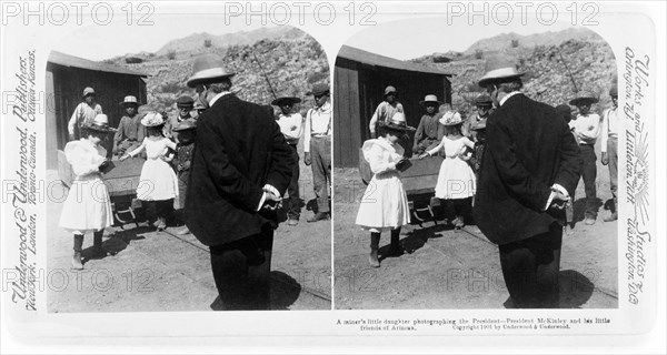 A Miner's Daughter Photographing the President--President McKinley and his little friends of Arizona, Stereo Card, Underwood & Underwood, 1901