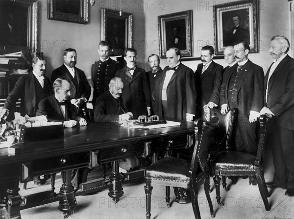 U.S. President William McKinley Looks on as Peace Protocol is Signed by French Ambassador Pierre Paul Cambon, Leading to the end of the Spanish-American War, Washington DC, USA, Francis Benjamin Johnston, August 12, 1898