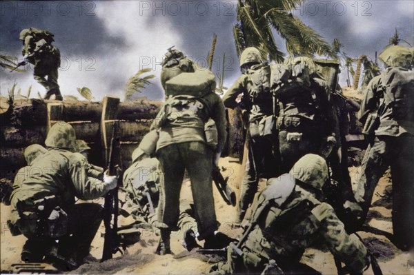 U.S. Marines Climbing over Coconut Log Seawall during Battle of Tarawa, Tarawa Atoll, Gilbert Islands, November 1943