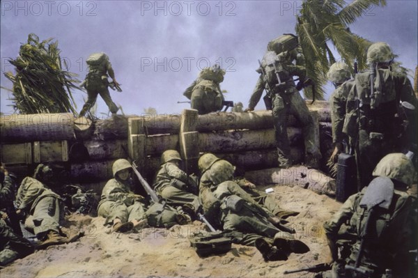 U.S. Marines Climbing over Coconut Log Seawall during Battle of Tarawa, Tarawa Atoll, Gilbert Islands, November 1943