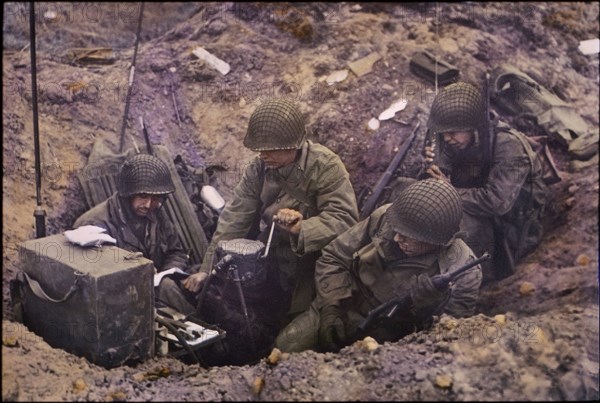 U.S. Soldiers Powering Radio Set using GN-45 Hand Crank Generator, Pointe du Hoc, Normandy, France, June 1944