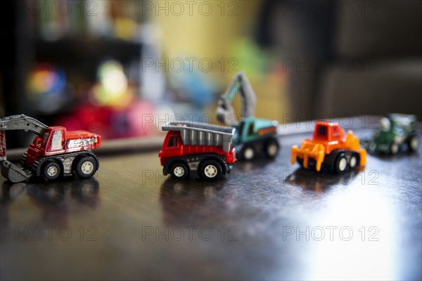 Miniature Toy Trucks on Table