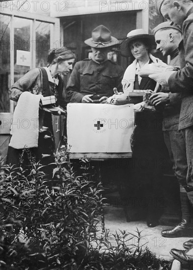 American Army Lieutenant Robert E. Lee Supervising the Packing of Red Cross Care Package by Women of the American Red Cross Care Committee, Newcastle, England, UK, Photograph by American National Red Cross, November 1918