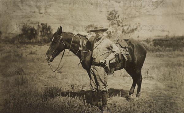 Full-Length Portrait of Theodore Roosevelt Standing Alongside Horse, Wearing Cowboy Outfit, Photograph by T.W. Ingersoll, 1910